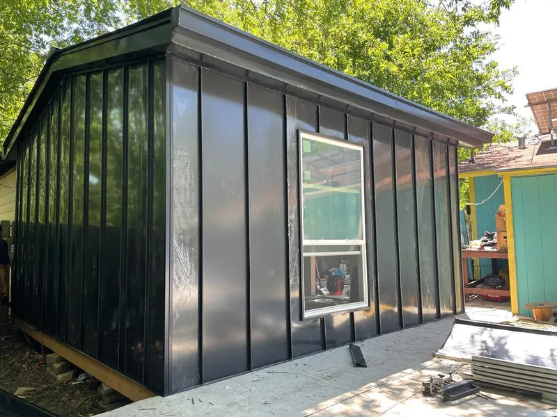 Black standing seam metal wall panels for Roof Inspection in Bedford